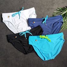 Load image into Gallery viewer, Pride Month Edition Swim Trunks with Rainbow Flag Speedos dark blue
